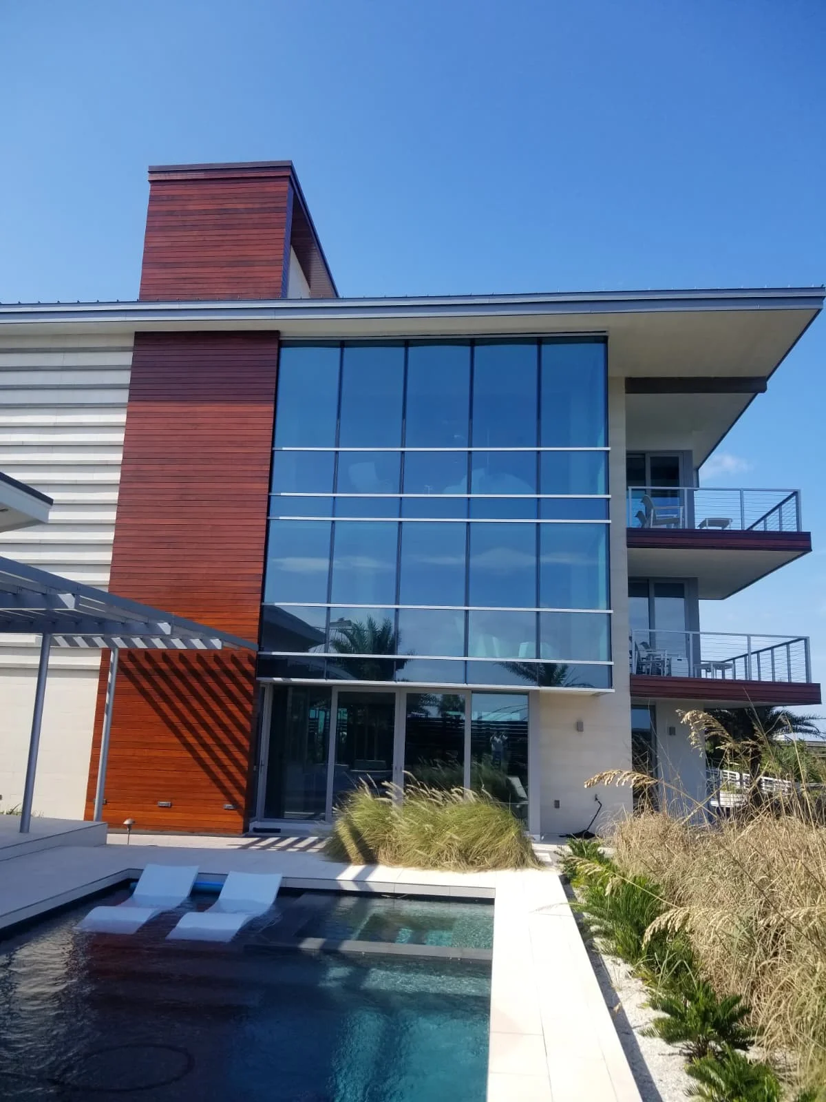Modern multi-story home exterior remodeled by HammerHead Remodeling in Jacksonville, FL